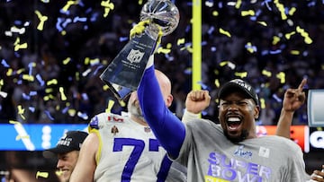 American Football  - NFL - Super Bowl LVI - Cincinnati Bengals v Los Angeles Rams - SoFi Stadium, Inglewood, California, United States - February 13, 2022 Los Angeles Rams' Von Miller and Andrew Whitworth celebrate with the Vince Lombardi Trophy afte